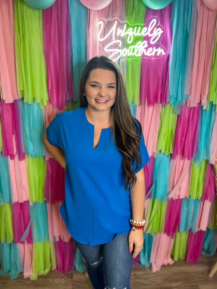 WOVEN AIRFLOW SPLIT NECK SHORT SLEEVE TOP