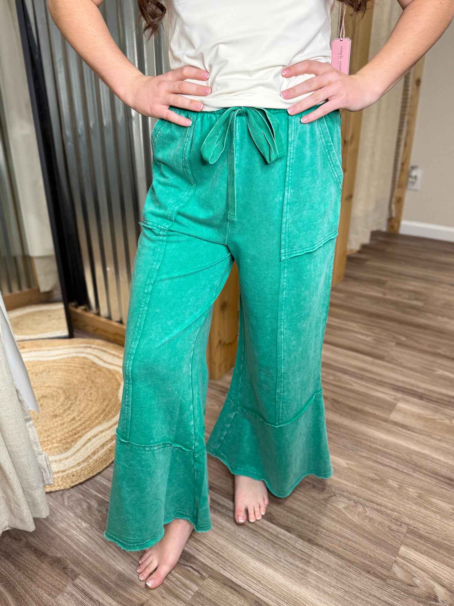 K GREEN | EXPOSED-SEAM FLARE HEM PANTS WITH POCKETS