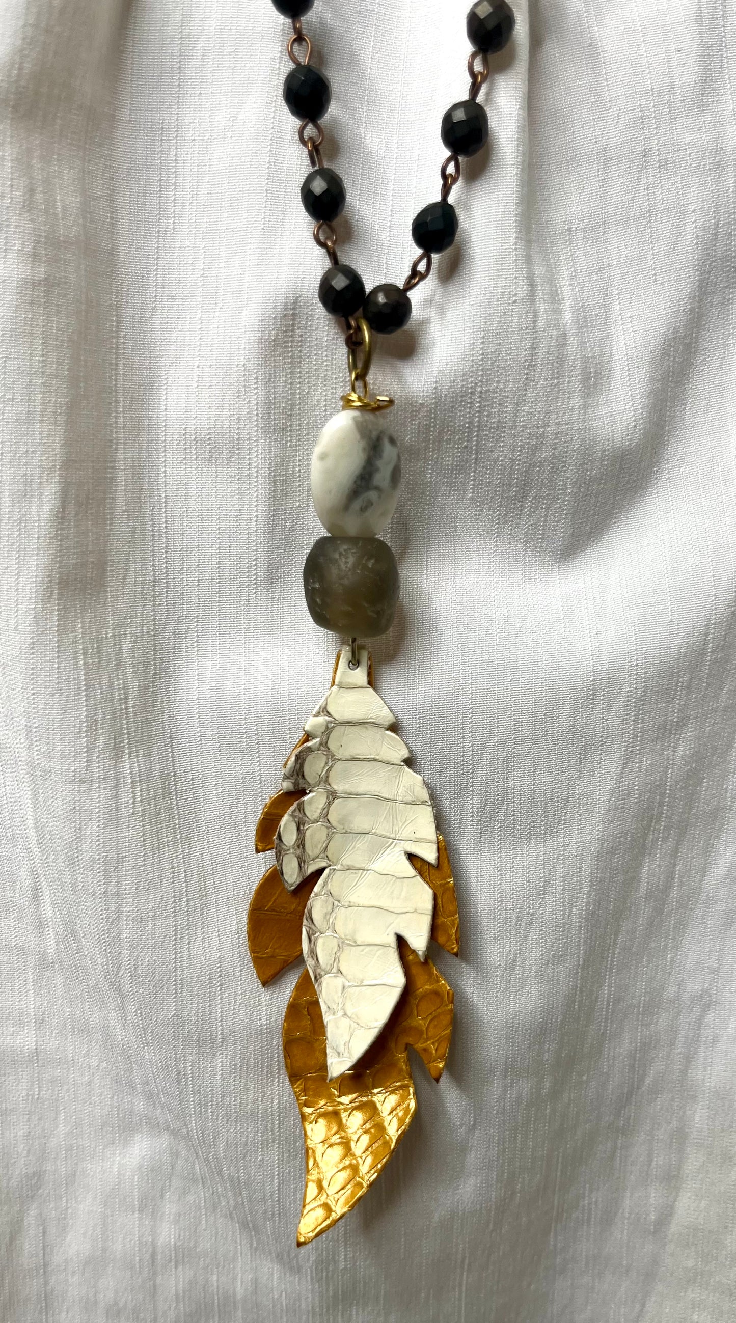 Black Beaded Necklace with Mustard Leather Feather Pendant