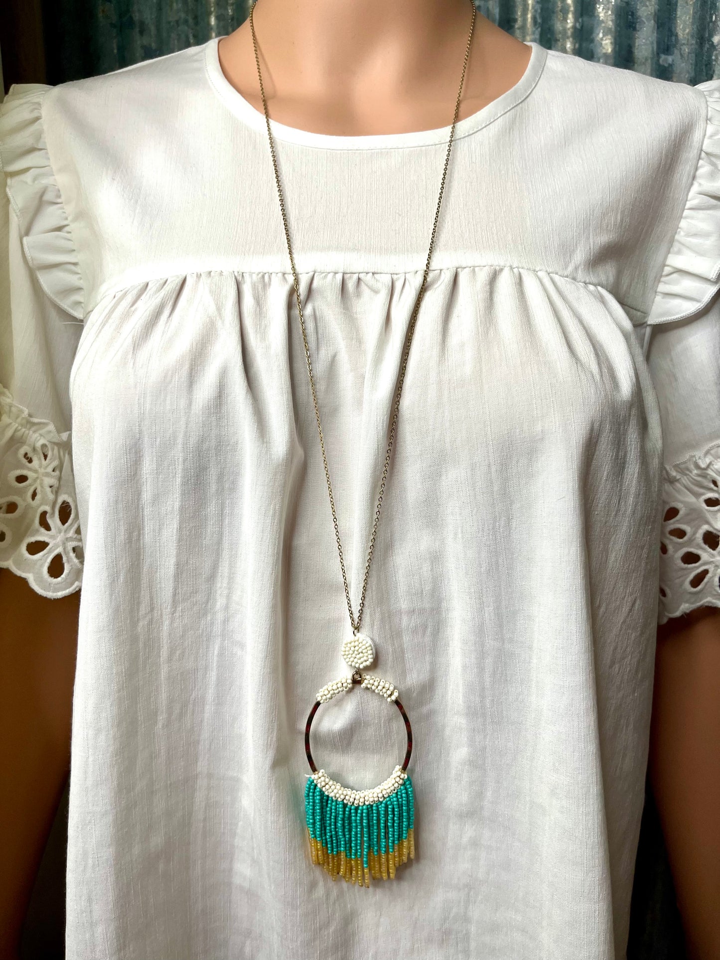 White Beaded Necklace with Teal & Gold Fringe